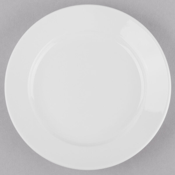 A Libbey Porcelana round porcelain plate with a wide white rim.