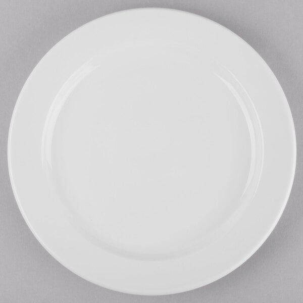 A Libbey Porcelana white porcelain plate with a wide white rim.