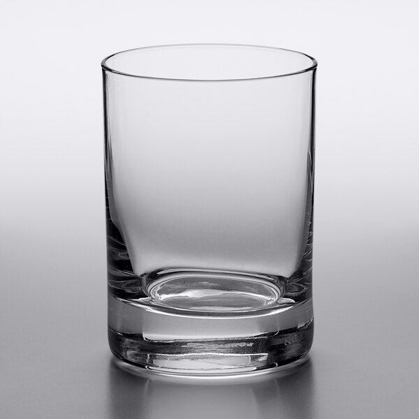 A close-up of a clear Reserve by Libbey Modernist Rocks glass with a small bottom.