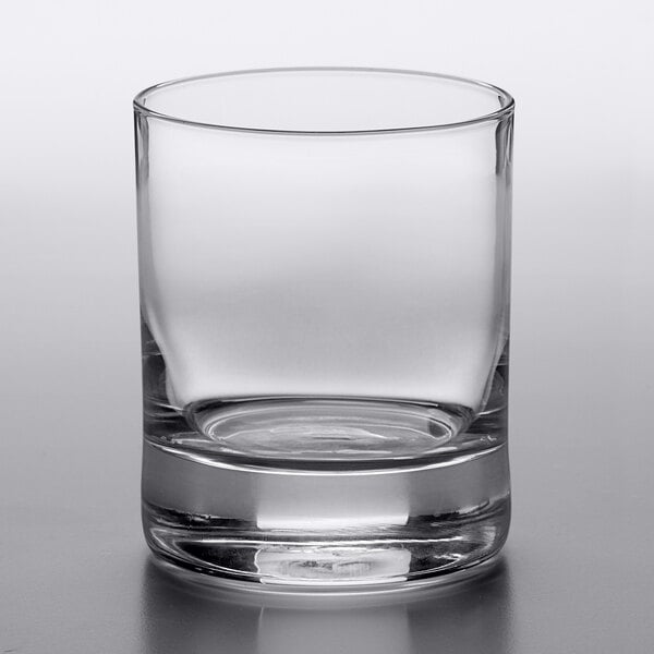 A Reserve by Libbey Modernist rocks glass with a small bottom on a white background.