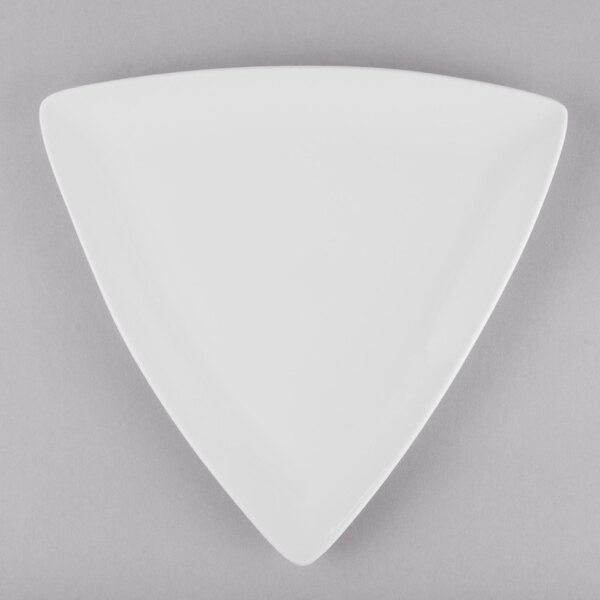 A white Libbey Porcelana triangle shaped coupe plate.