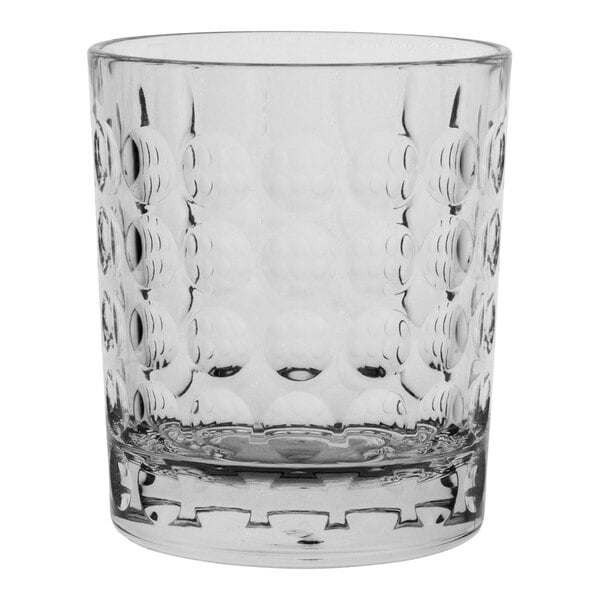 A clear Aspen Carve glass tumbler with a patterned design.