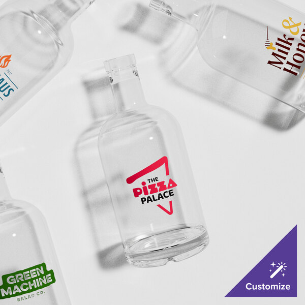 A group of Acopa clear glass bottles with red text.