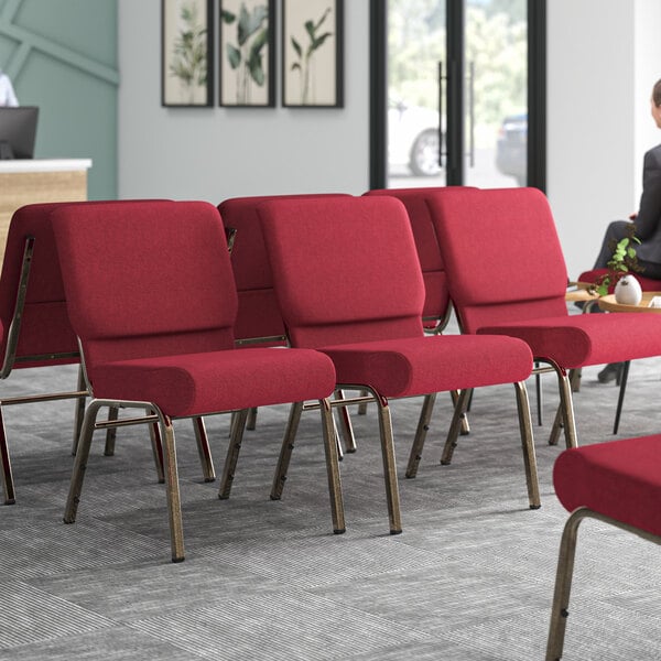 Lancaster Table & Seating church chairs with burgundy fabric in a room