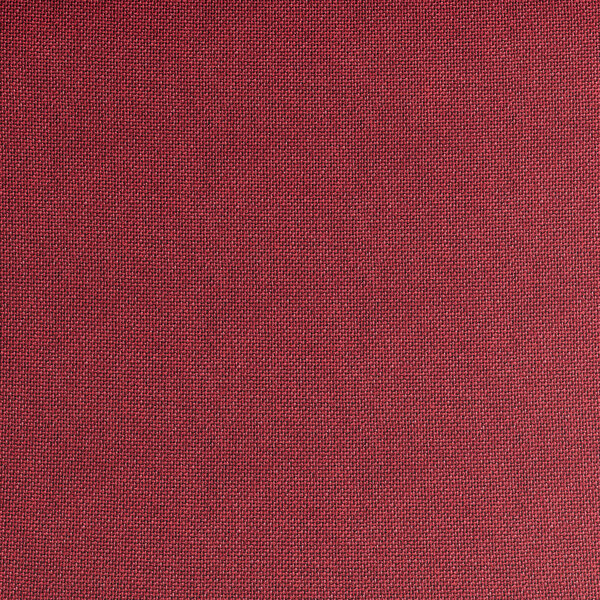 A close up of the burgundy fabric on a Lancaster Table & Seating church chair.