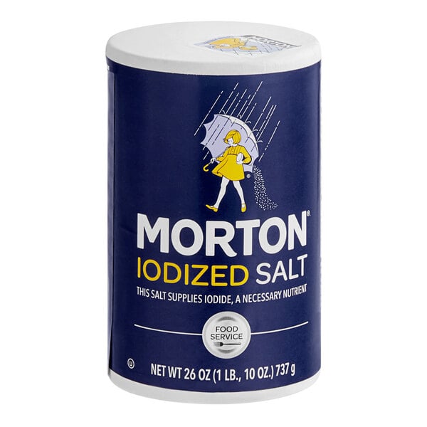 A blue and white container of Morton Iodized Salt on a grocery store shelf.