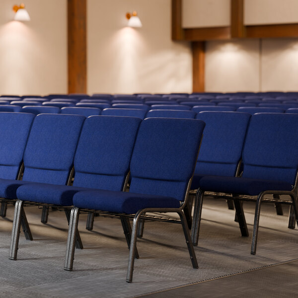 A row of Lancaster Table & Seating church chairs with blue fabric.