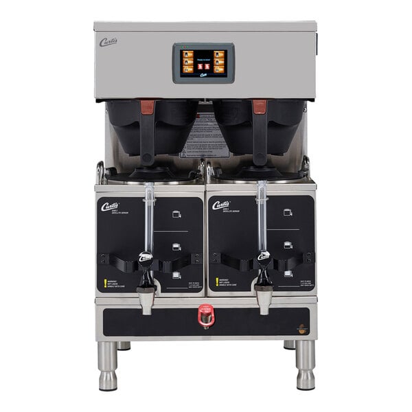 A stainless steel commercial coffee brewing machine with two large dispensers, a digital control panel, and two spouts for dispensing coffee.