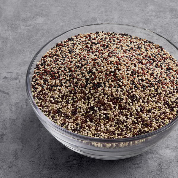 A glass bowl of mixed Tri-Color Quinoa.