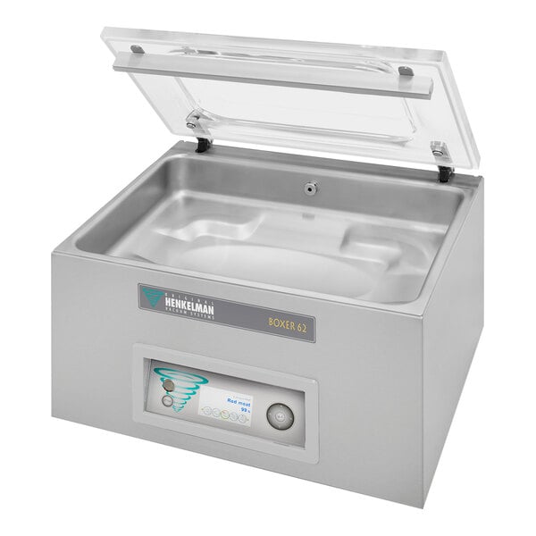 A silver Henkelman BOXER62 vacuum packaging machine on a counter with a lid.