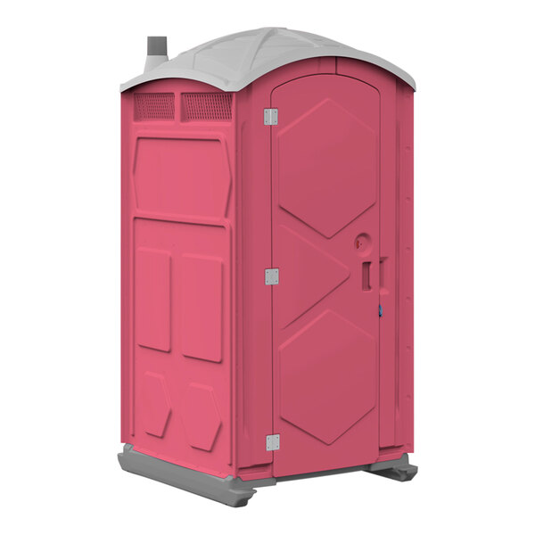 A pink portable restroom with a grey door.