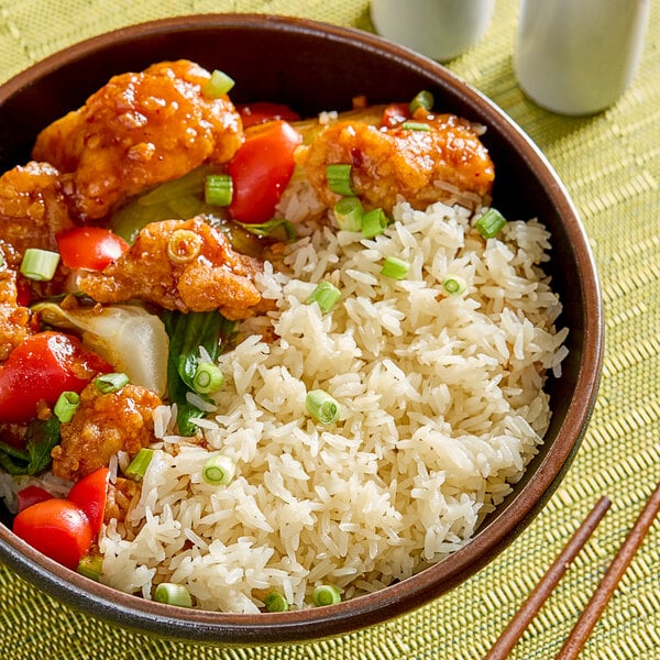 A bowl of jasmine rice with vegetables.