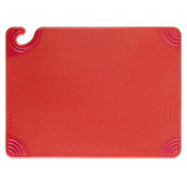 A San Jamar red plastic cutting board with a hook.