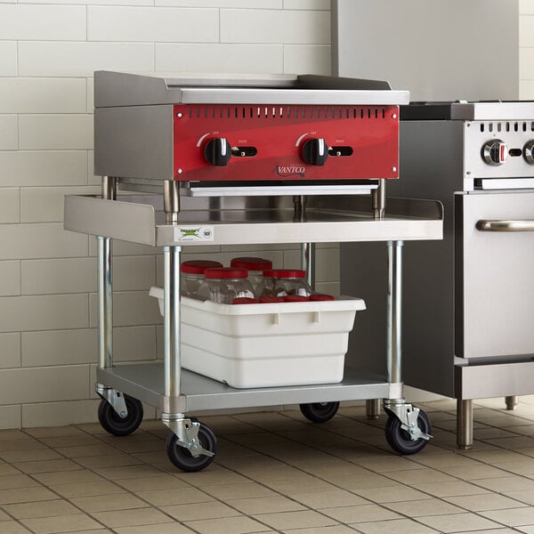 A red and silver Regency stainless steel equipment stand with a white container on top.