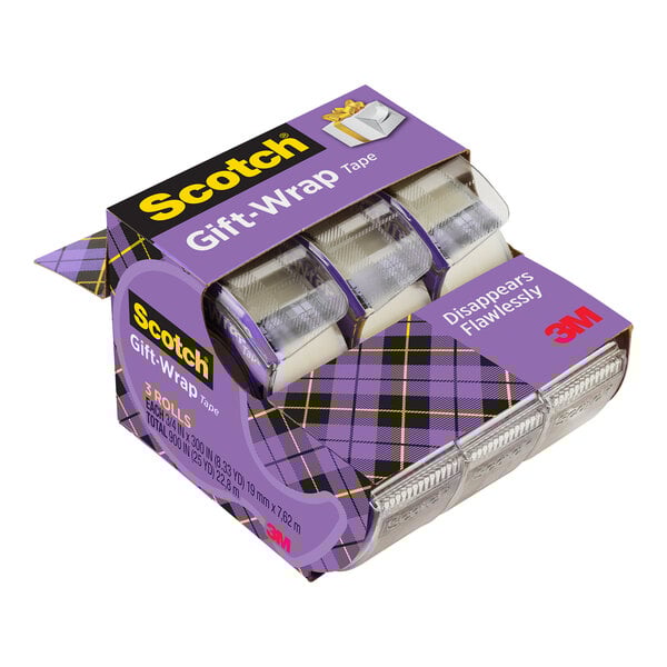 A box of 3M Scotch transparent invisible tape with a purple and black plaid dispenser.