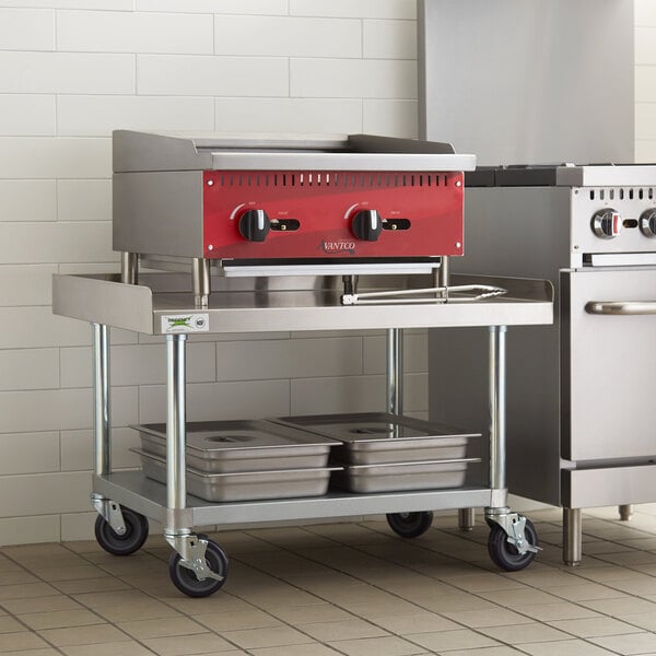 A Regency stainless steel equipment stand on a kitchen counter.