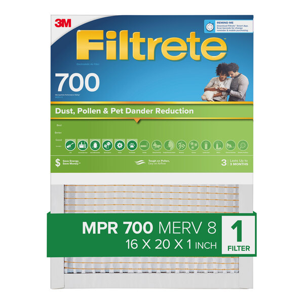 A woman holding a box of 3M Filtrete MPR 700 air filter.