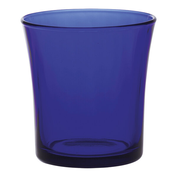 A blue Duralex Lys tumbler on a white surface.