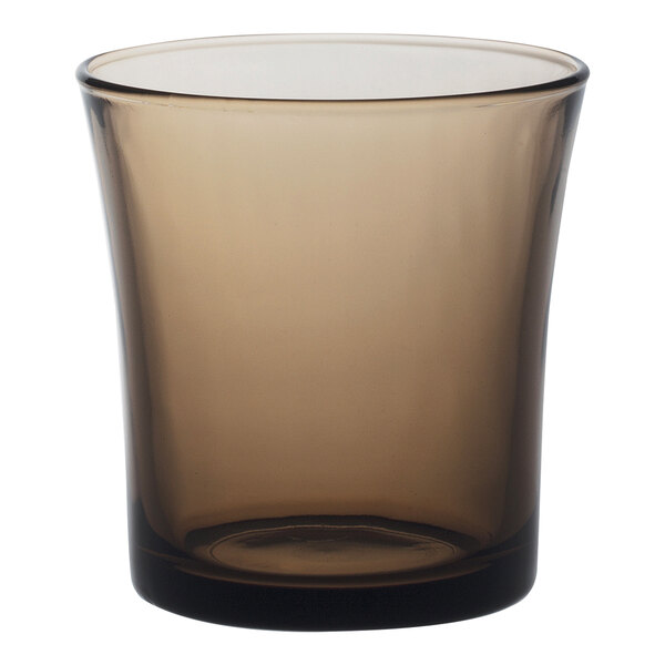 A brown Duralex glass on a white background.