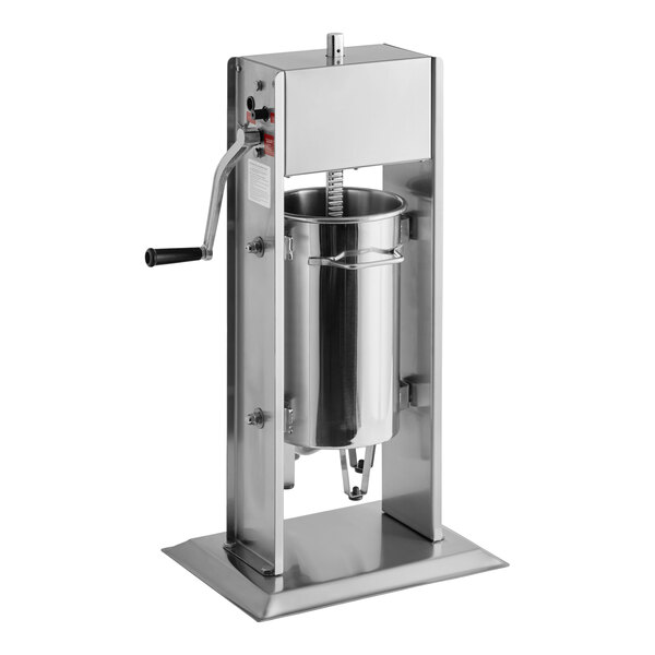 A stainless steel vertical manual sausage stuffer with a hand crank and multiple funnel attachments.