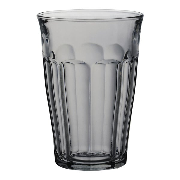 A clear glass with a ribbed rim.