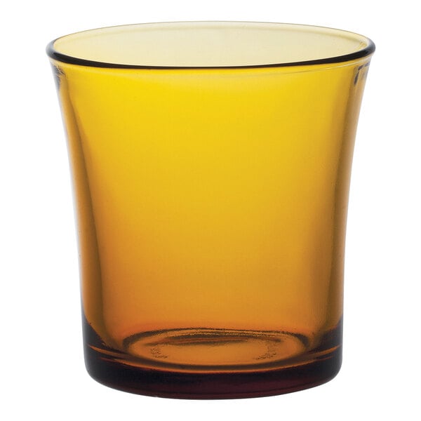 A yellow Duralex Lys tumbler with a brown rim.