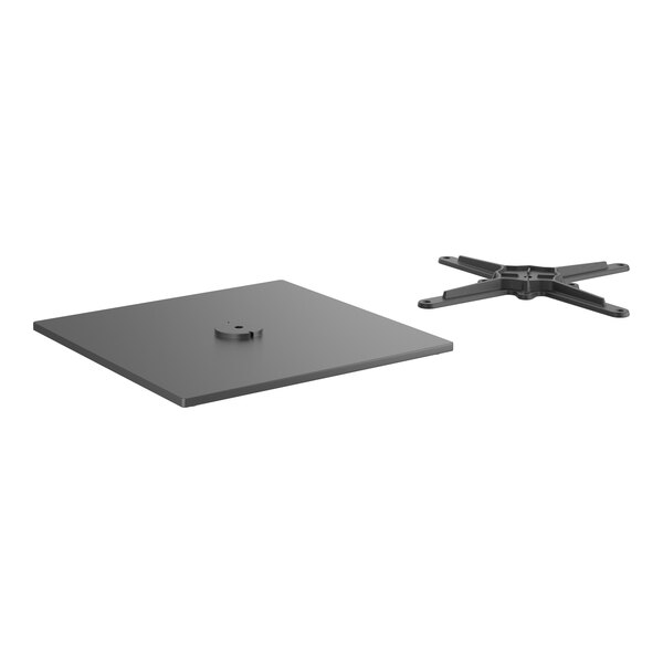 A black square steel table base plate with a hole in the center.