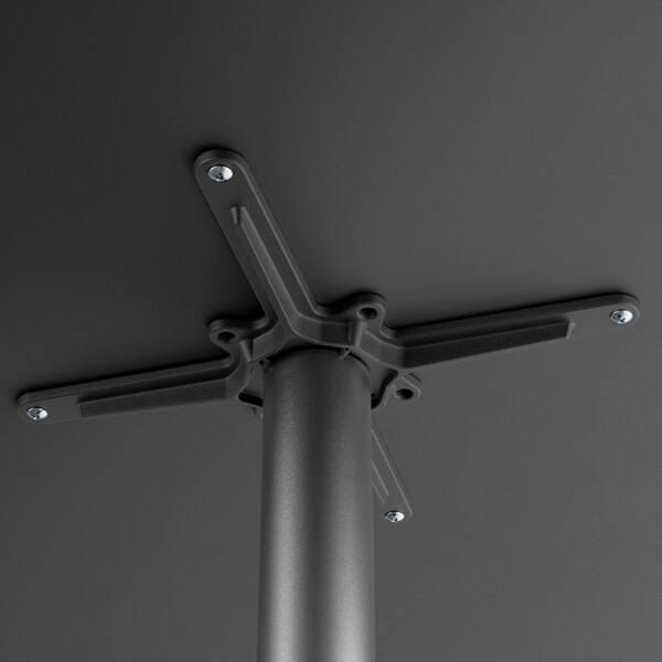 A metal pole with a black metal table base plate and spider.