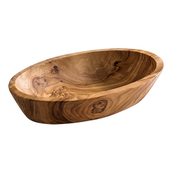 An oval olive wood bowl with a carved face.