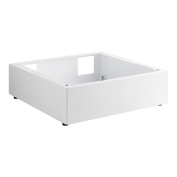 A white square Speed Queen pedestal with a hole in the middle and black wheels.