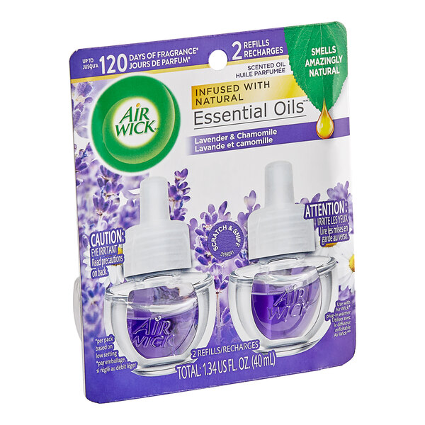 A white box containing two Air Wick Lavender and Chamomile scented oil fragrance diffuser refills. One of the refills is a white bottle with a purple lid.