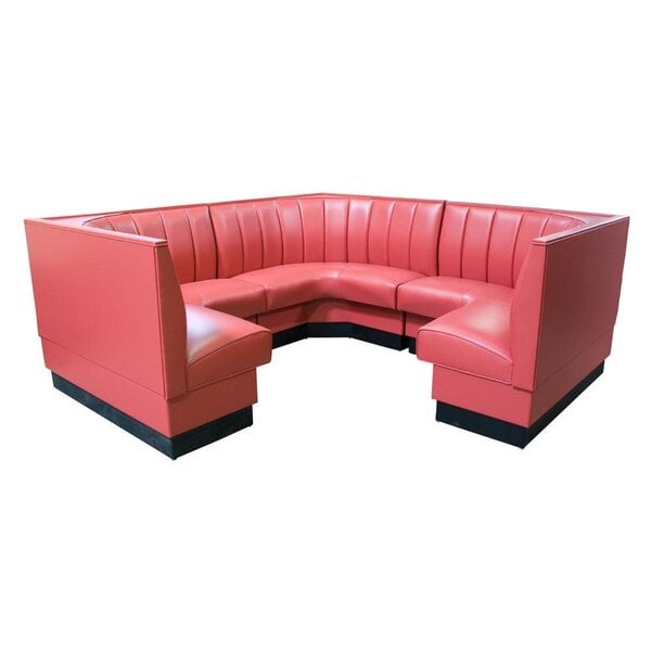 A red upholstered corner booth with black base.