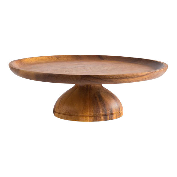 A round wooden cake stand with a pedestal base.