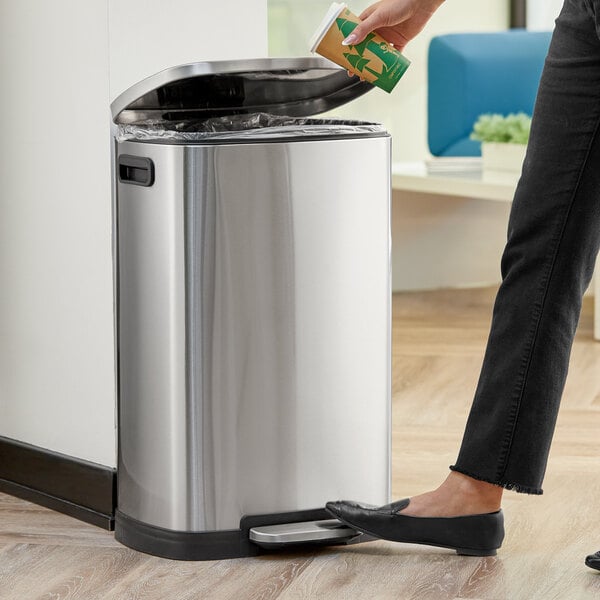 A stainless steel rectangular step-on trash can with a soft close lid.