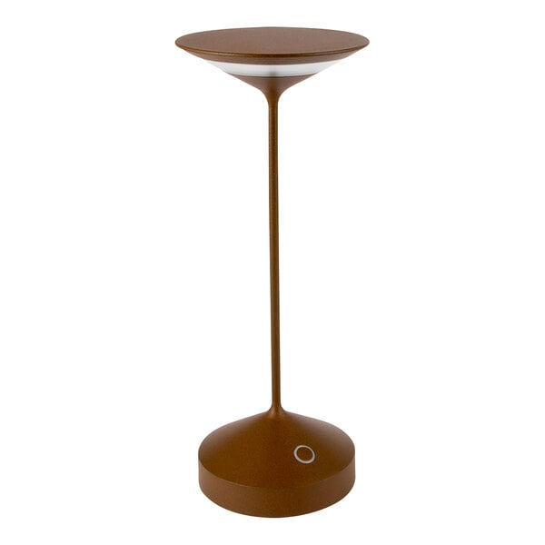 An Abert Tempo copper table lamp with a white circle on top on a brown table.