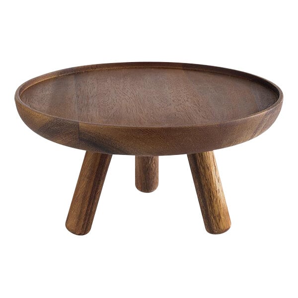 A round wooden display stand with legs.