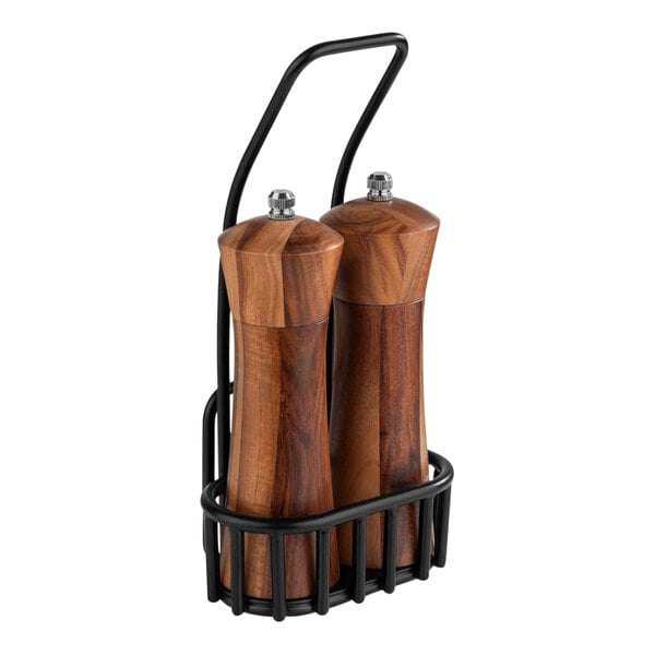 An APS Urban Acacia salt and pepper mill set in a black metal holder.