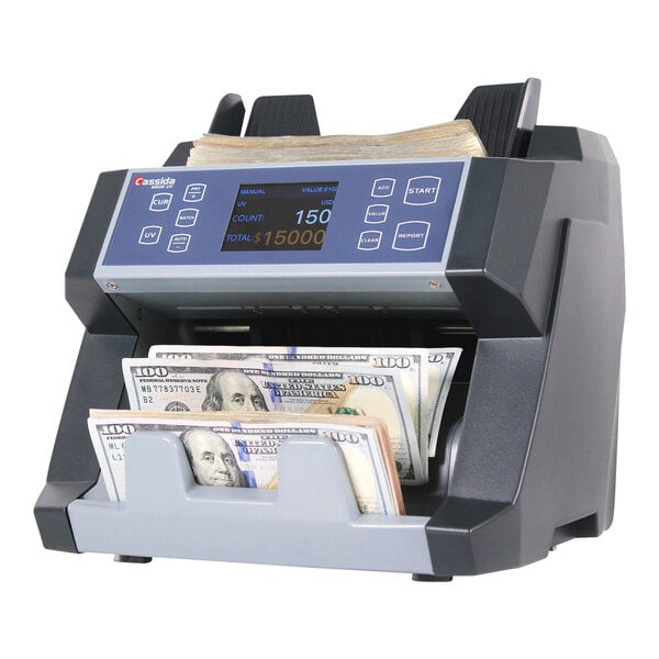 A Cassida B-6600UM top loading bill counter with UV and magnetic counterfeit detection, shown counting U.S. currency.