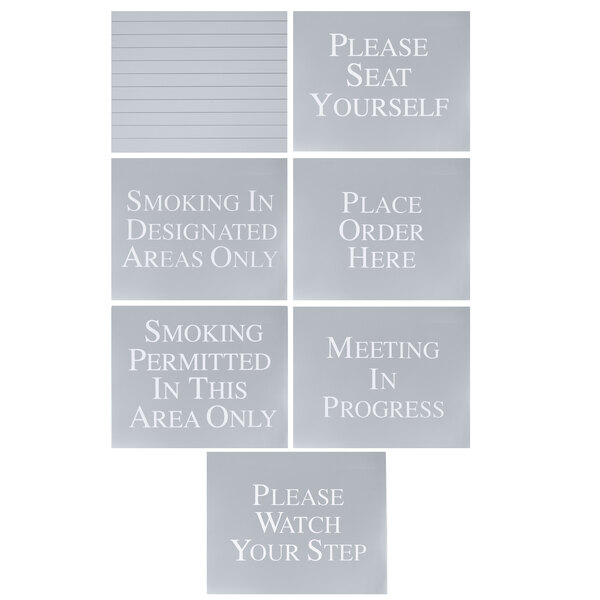 A group of four Aarco black signs with white text for 12 messages.