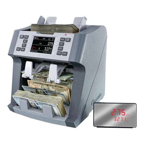 A Cassida 9900R bill counter with a display counting bills.