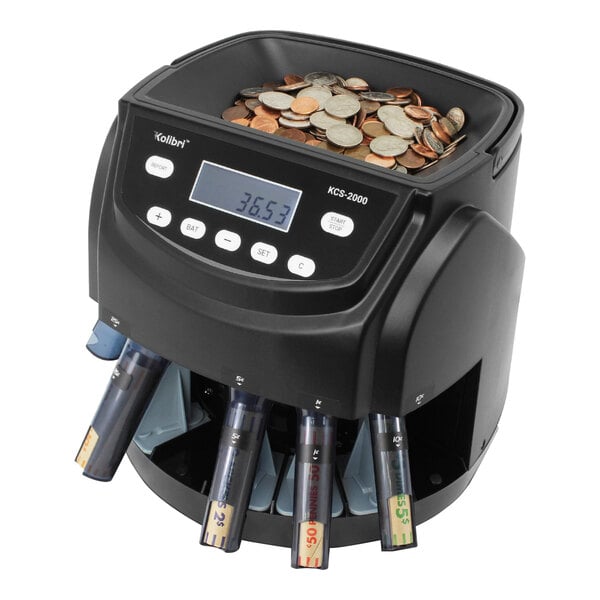 A black Kolibri coin counting machine with coins in it.