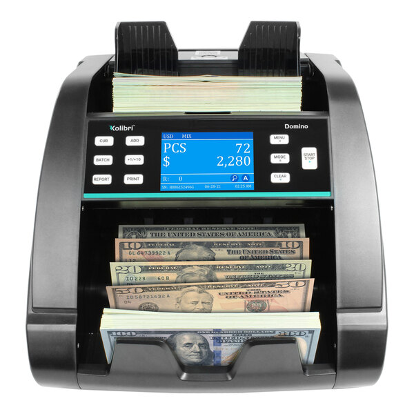 A black Kolibri B-DOMINO electronic bill counter with money in it.