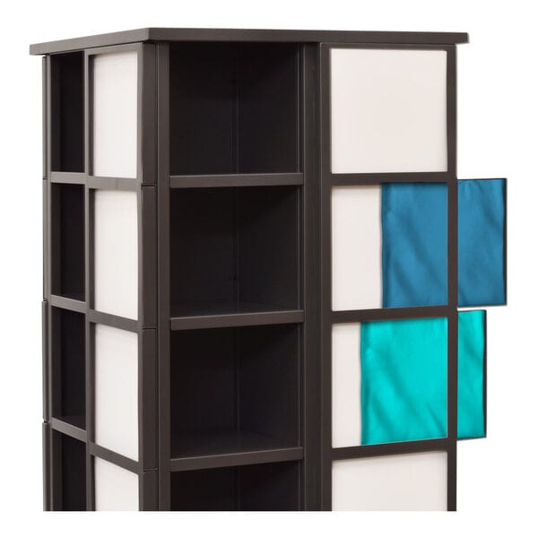 A black and white steel mobile clothing display with blue and white squares on the shelves.