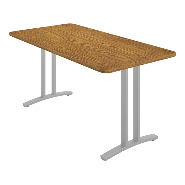 A rectangular wood table with metal legs.