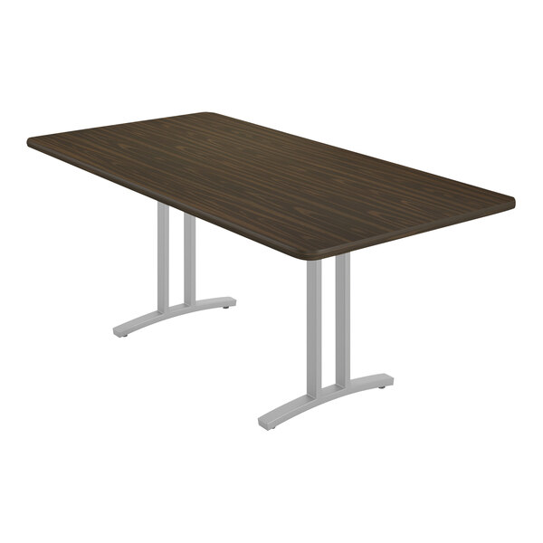 A brown rectangular Correll conference table with white legs.
