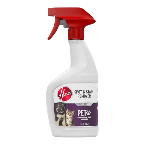 A close-up of a white Hoover Paws and Claws pet stain remover spray bottle with a red handle.