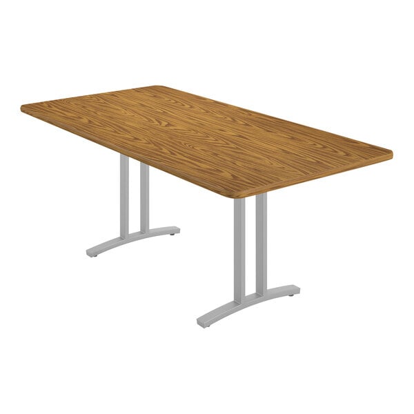A rectangular Correll conference table with a metal base.