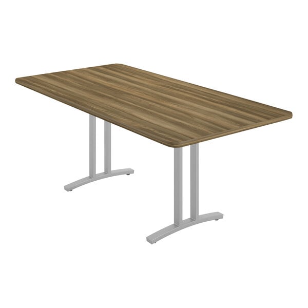 A Correll rectangular conference table with a wood top and metal base.