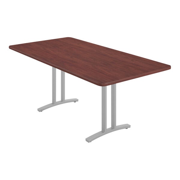 A rectangular Correll conference table with metal legs.