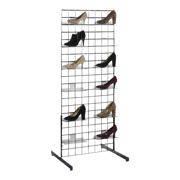 A black steel grid shoe display rack with 10 acrylic shelves holding different shoes.